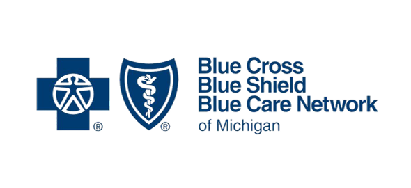 Blue Cross Blue Shield Blue Care Network of Michigan logo with shield and medical symbols.